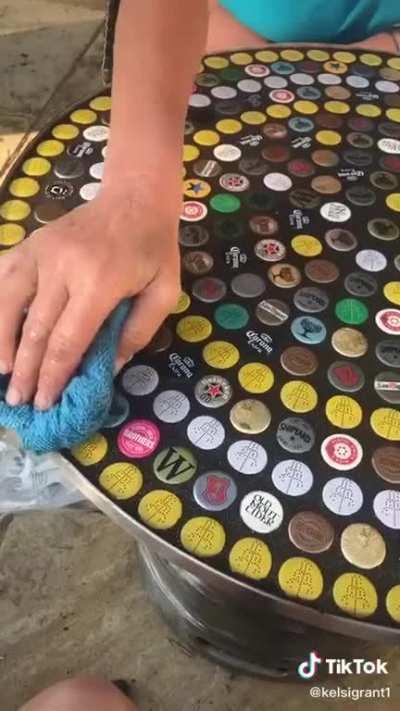 Covering a table in bottle tops