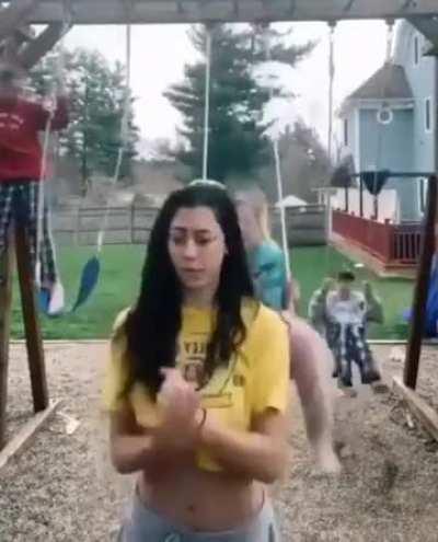 To make a TikTok in front of swinging kids