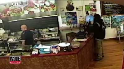 Store clerk ignores an armed robber, so the robber leaves