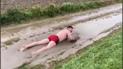 Someone swimming at one of the cobblestone section of Paris Roubaix