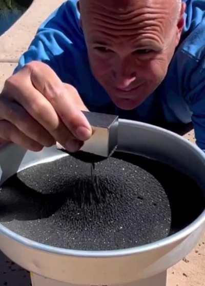 Super magnet attracting magnetite sand