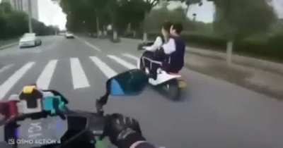 Motorcyclist Crashes Right After Flicking Off Scooter