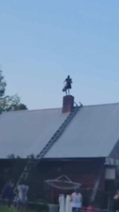 Man throwing some heavy bars on a roof