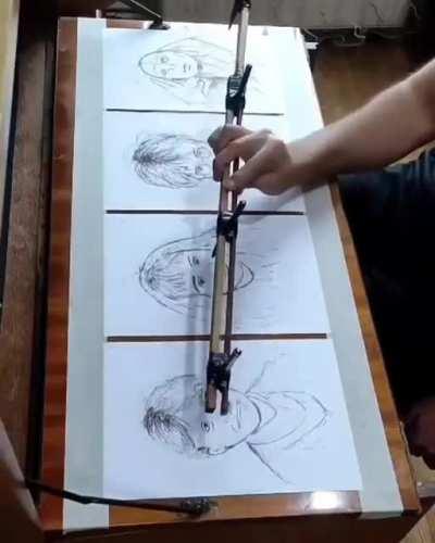 Man draws multiple pictures at the same time