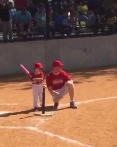 Teaching her t ball