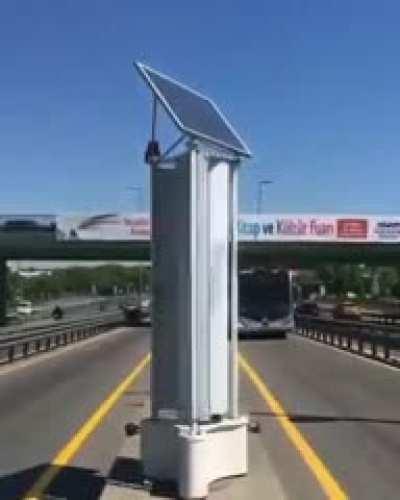 Traffic powered wind turbine