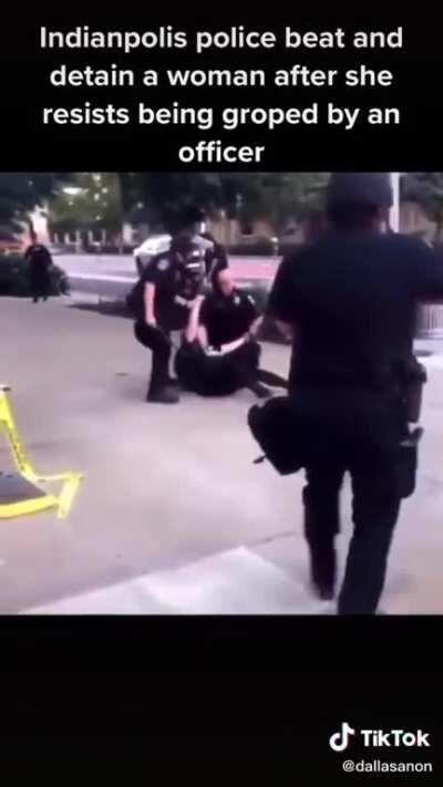 Indianapolis Cops beat a female protester after resisting being groped by an officer