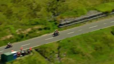 Squeezing through a tiny gap whilst doing close to 200mph. Peter Hickman, Isle of Man TT races, 2023.