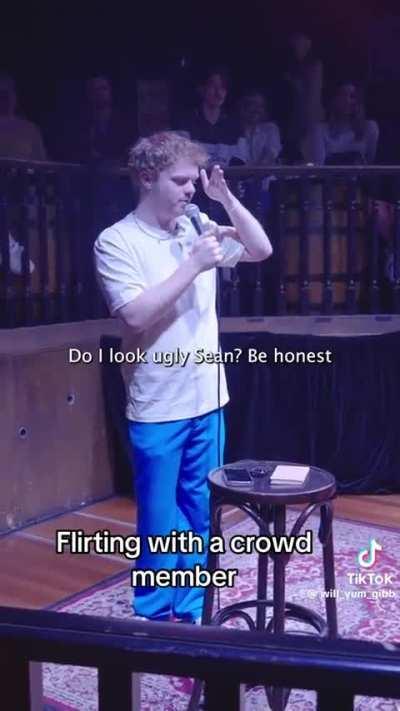 Flirting during his stand up routine 