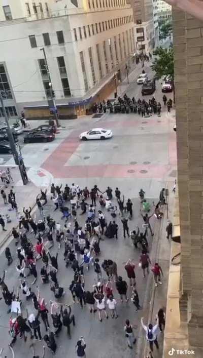 Texan Cops Shooting Tear Gas Grenades at Peaceful kneeling Protestors