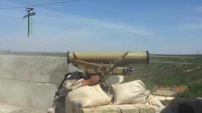 Opposition 9K115 Metis-M team strike on an SAA tank turret peeking over a berm - Morek - 6/6/2014