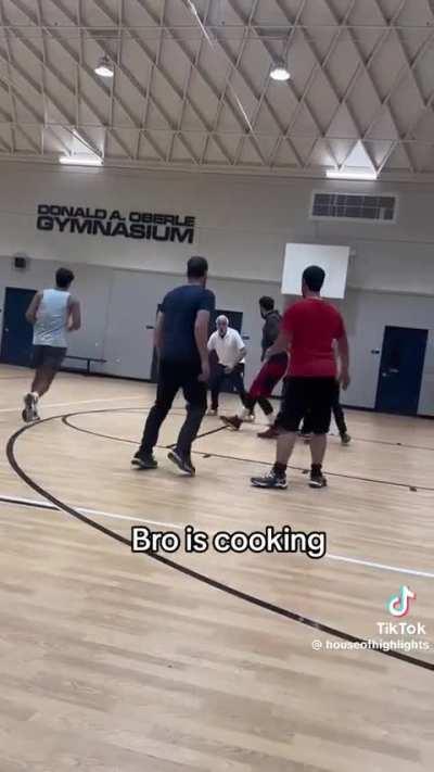 A grandpa schooling youngins on the court