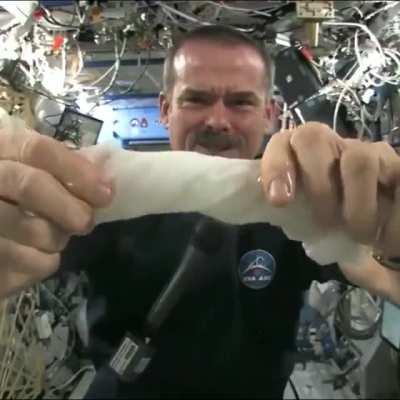 This is what happens when you wring out a wet towel while floating in space.