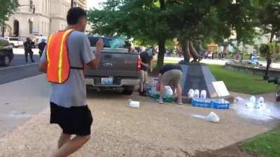 Cops sneak up to confiscate &amp;amp; destroy water and other supplies peaceful protestors are using in Louisville, KY