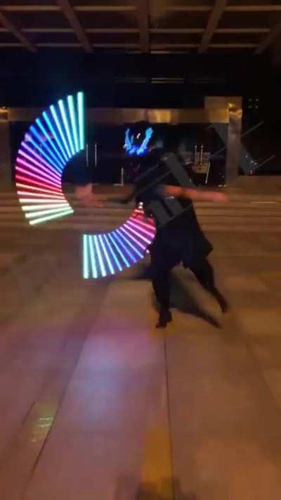 Guy spinning a lightsaber