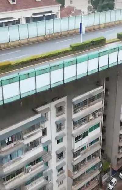 Road constructed on top of apartments in China.