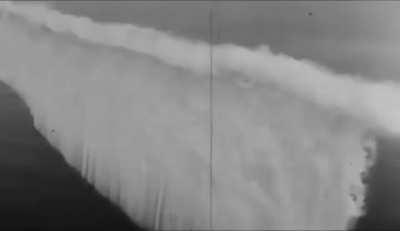 Pre-WWII footage of a smoke curtain, used to hide ships during a naval battle, being deployed.