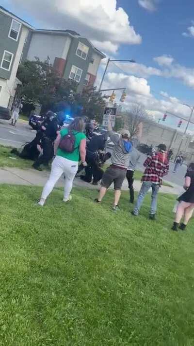 Cop uses riot helmet as a weapon while retaining a protester. Toledo, OH 05/30/20