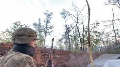 Ukrainian soldier drinking coffee while in a gunfight somewhere between Lyman and Bakhmut