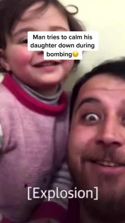 Father teaches child to laugh at the sounds of bombs exploding