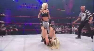 Angelina Love giving Madison Rayne a heartfelt stomp