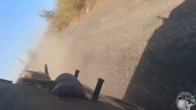 Russian soldiers on a Desertcross is hit by an Ukrainian kamikaze drone while driving and shooting towards it. In Zhelanne, east of Pokrovsk . October 2024