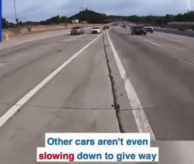 Guy stuck in middle of highway