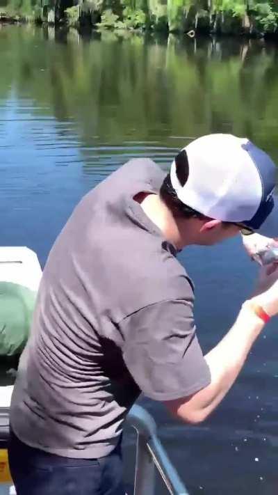 Dude uses a gator as a can opener 