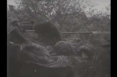 20mm Flak gun on an Sd.Kfz. 10 half-track fires on a building near Aachen in 1944