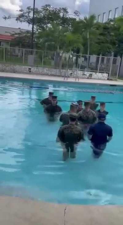 Official pinning ceremony for promotion to Sergeant. They let you pick where you want to have the ceremony. New Sargeant chose to have it in the swimming pool.