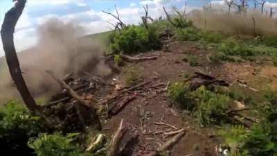 POV footage of a Russian soldier experiencing a close hit from an FPV drone, second clip shows him and his comrades assaulting a fortified position (POV and drone view mixed), Zaporizhzhia Oblast