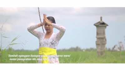 A Balinese woman offering prayers to Dewi Sri. Shrines of Lakshmi can be found in paddy fields all across Indonesia as the goddess is considered the deity of agriculture and prosperity.