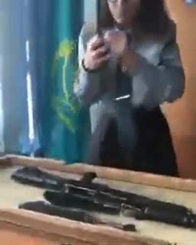 This Kazakhstani woman field stripping an AK-47