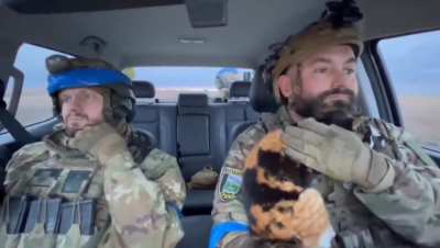 Ukrainian soldiers with a furry companion, en route to Ukraine-controlled Sudzha, Kursk region