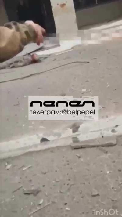 RU POV Site of an explosion in Belgorod. A killed Russian soldier is in the video