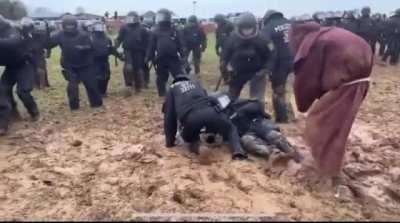 These German cops struggling for their lives against this Mud Wizard of some kind