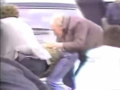 Man throws grenades into a crowd of people during a funeral in Milltown Cemetery, Northern Ireland.