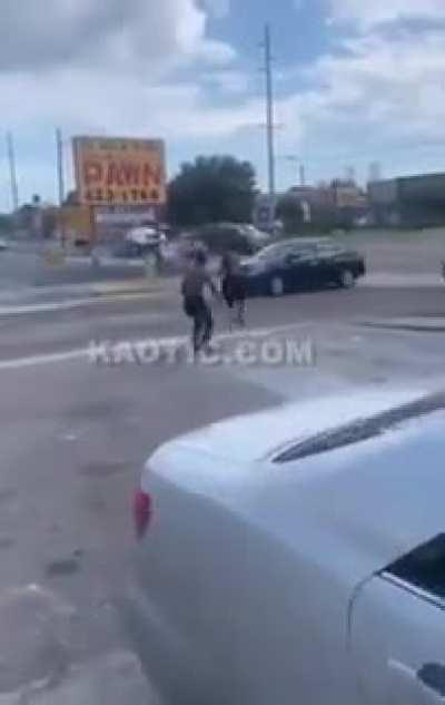 Guy runs into road to avoid a fight, gets hit by car