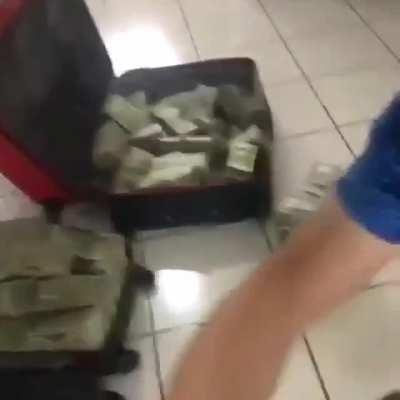 Sinaloa cartel members with suitcases full of money