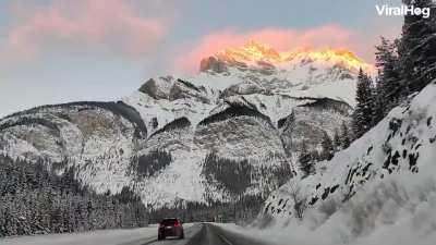 When you drive through Banff National Park at sunset...