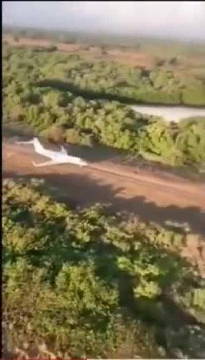 Drug traffickers' jet escaping a military helicopter in Jalisco, Mexico.