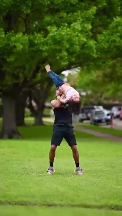 Father is a acrobat. His daughter inherited all his talent genes.