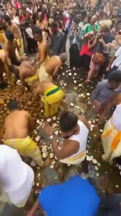 Coconut bashing by indians on the streets of Paris, France  