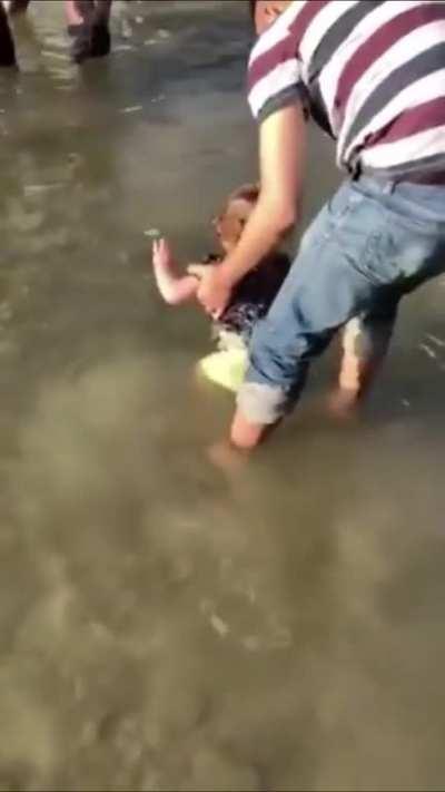 Family playing in waters in a kurdish village moments before turkey bombs them