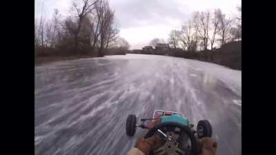 Ripping around a frozen river in go karts with studded tires and 250cc 2-stroke engines