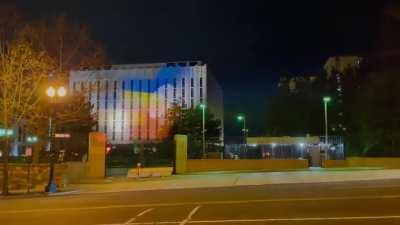 Someone projected the Ukrainian flag on the Russian Embassy in D.C. The Russians tried to drown out the projection with a spotlight- and failed.