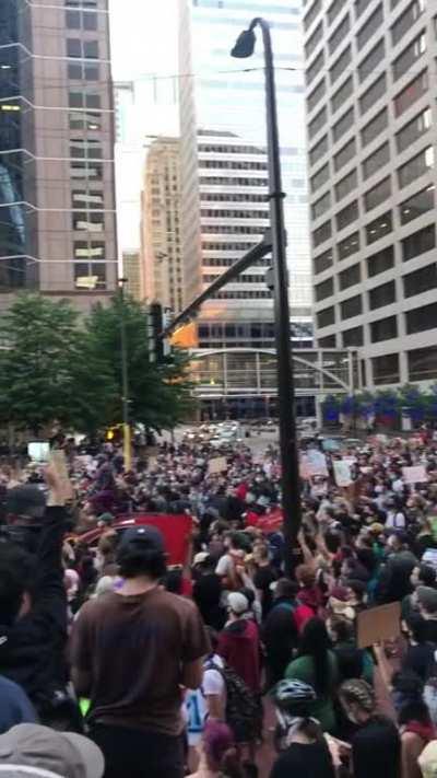 The peaceful protest downtown before tear gas and flashbangs got launched into crowds who began throwing bottles at police.