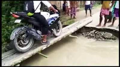 Guy Gets Washed Away After Falling Off Bike