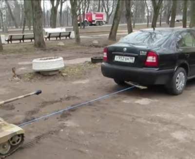 Mini tank towing a car