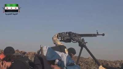 Yarmouk Army DShK gunner liberally applies rounds to an SAA sandbagged position - 11/20/2014